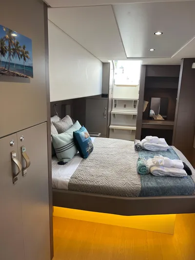  Yacht Photos Pics Luxurious cabin interior of 2020 Bali 4.8 yacht with cozy bed and modern decor.