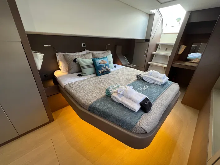  Yacht Photos Pics Luxurious bedroom interior of 2020 Bali 4.8 yacht with modern design and ambient lighting.