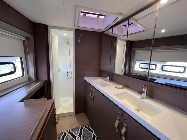  Yacht Photos Pics Luxurious bathroom in a 2020 Bali 4.8 yacht with dual sinks and modern shower.