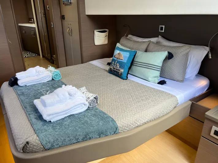  Yacht Photos Pics Luxurious Bali 4.8 yacht bedroom with neatly arranged bed and elegant decor, 2020 model.