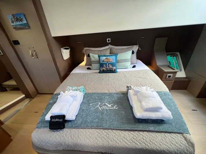  Yacht Photos Pics Luxurious bedroom interior on a 2020 Bali 4.8 yacht, featuring a neatly arranged bed.