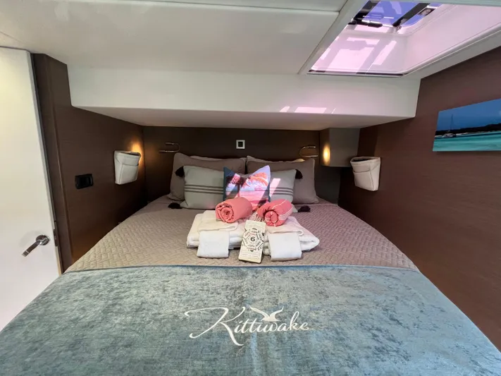  Yacht Photos Pics Luxurious cabin interior of 2020 Bali 4.8 yacht with neatly arranged bed and decor.
