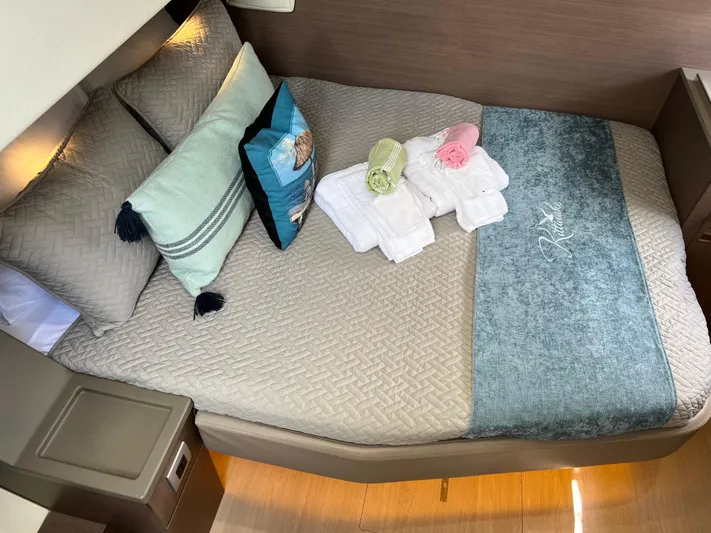  Yacht Photos Pics Luxurious cabin interior of a 2020 Bali 4.8 yacht with neatly arranged towels.
