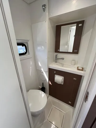  Yacht Photos Pics Modern bathroom in 2020 Bali 4.8 yacht with toilet, sink, and mirror.
