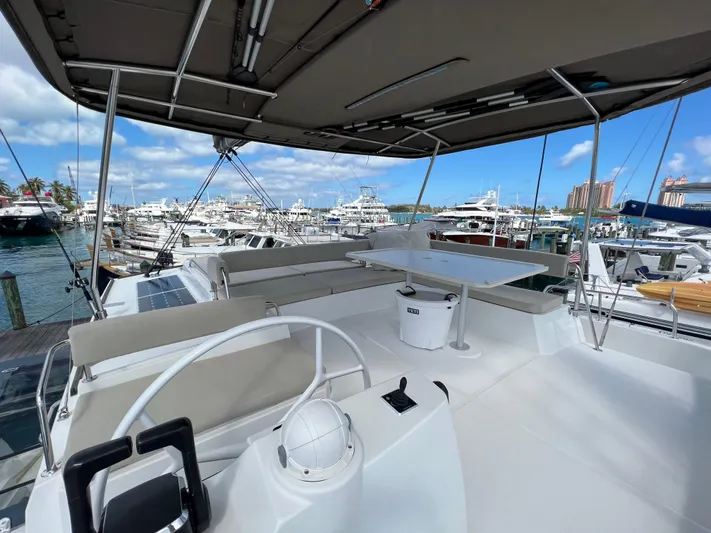  Yacht Photos Pics Spacious deck of 2020 Bali 4.8 catamaran docked at marina under clear skies.