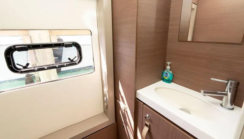  Yacht Photos Pics Modern bathroom interior in 2020 Bali 4.8 yacht with sink and window.