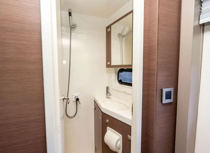  Yacht Photos Pics Compact bathroom in 2020 Bali 4.8 model, featuring shower, sink, and mirror.
