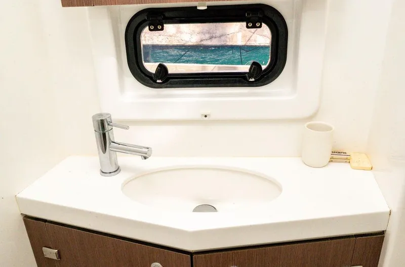  Yacht Photos Pics Modern bathroom sink in 2020 Bali 4.8 yacht with ocean view window.