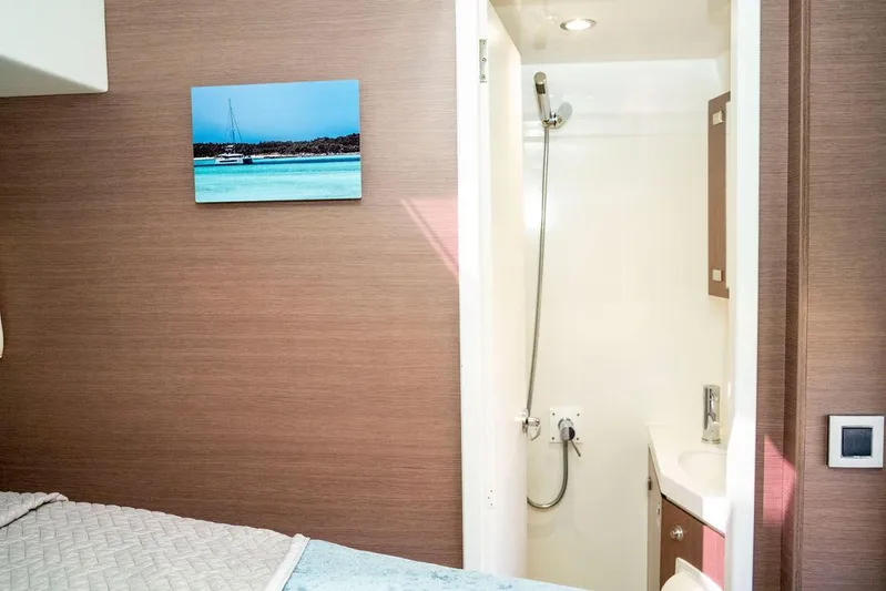  Yacht Photos Pics Interior of 2020 Bali 4.8 yacht cabin with shower and wall art.