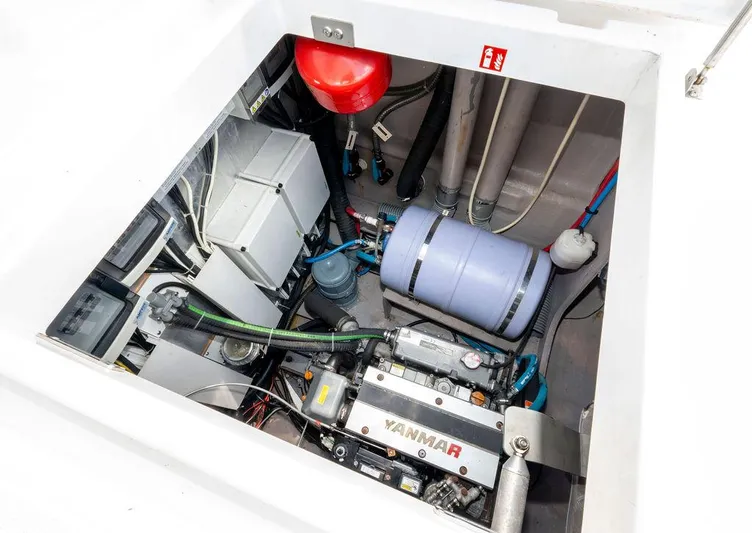  Yacht Photos Pics Engine compartment of a 2020 Bali 4.8 yacht featuring a Yanmar engine and various components.