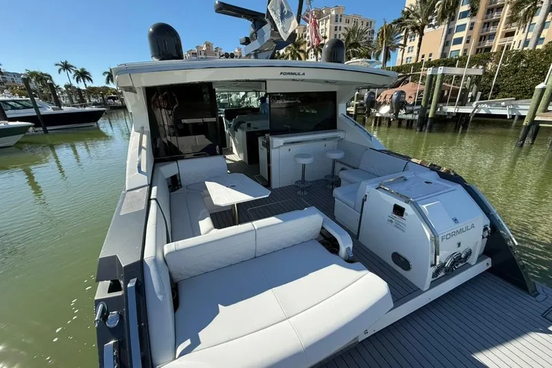  Yacht Photos Pics 2022 Formula 500 Super Sport Crossover luxury boat docked in sunny marina.