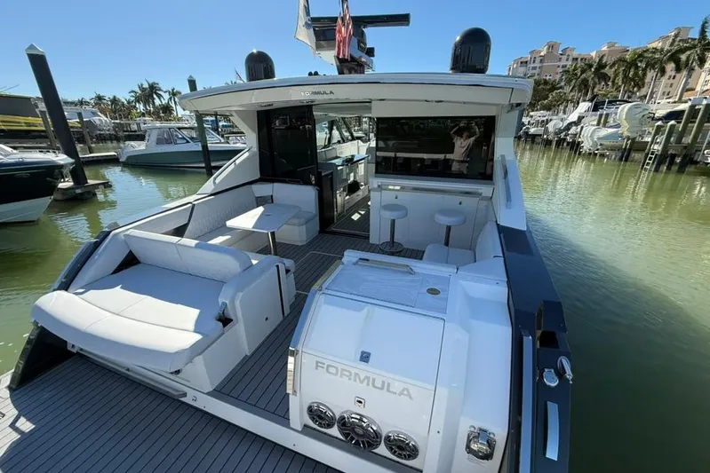  Yacht Photos Pics 2022 Formula 500 Super Sport Crossover yacht docked, featuring luxurious seating and modern design.