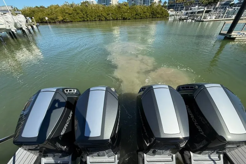  Yacht Photos Pics Four Mercury outboard engines on a 2022 Formula 500 Super Sport Crossover boat in a marina.