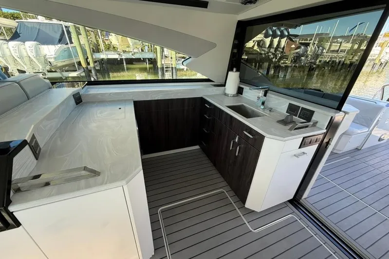  Yacht Photos Pics Luxurious interior of 2022 Formula 500 Super Sport Crossover yacht with modern kitchenette.