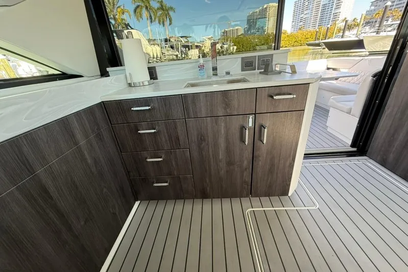 Yacht Photos Pics Modern interior of 2022 Formula 500 Super Sport Crossover yacht with sleek cabinetry and outdoor view.