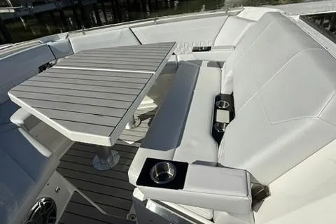  Yacht Photos Pics 2022 Formula 500 Super Sport Crossover boat interior with sleek seating and modern table design.
