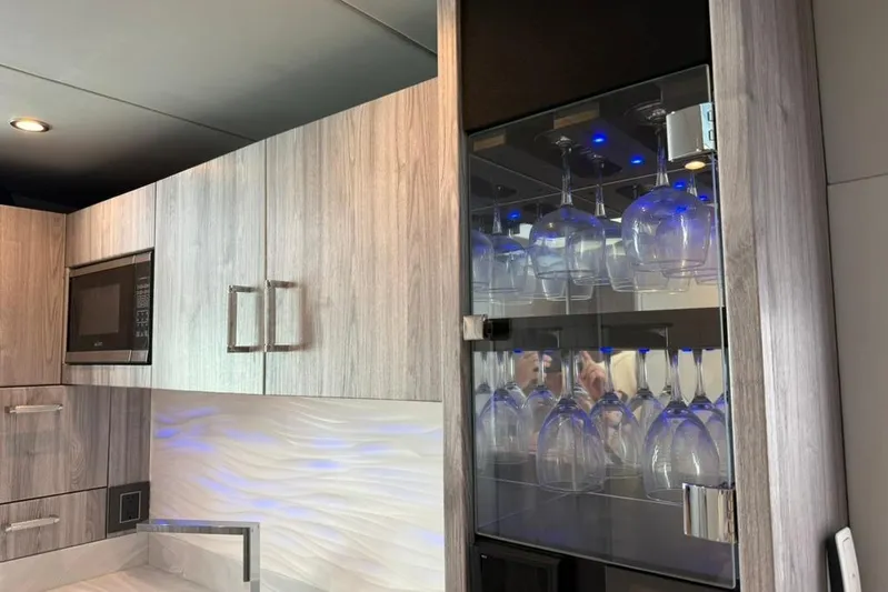  Yacht Photos Pics Modern kitchen in 2022 Formula 500 Super Sport Crossover with glass cabinet and microwave.