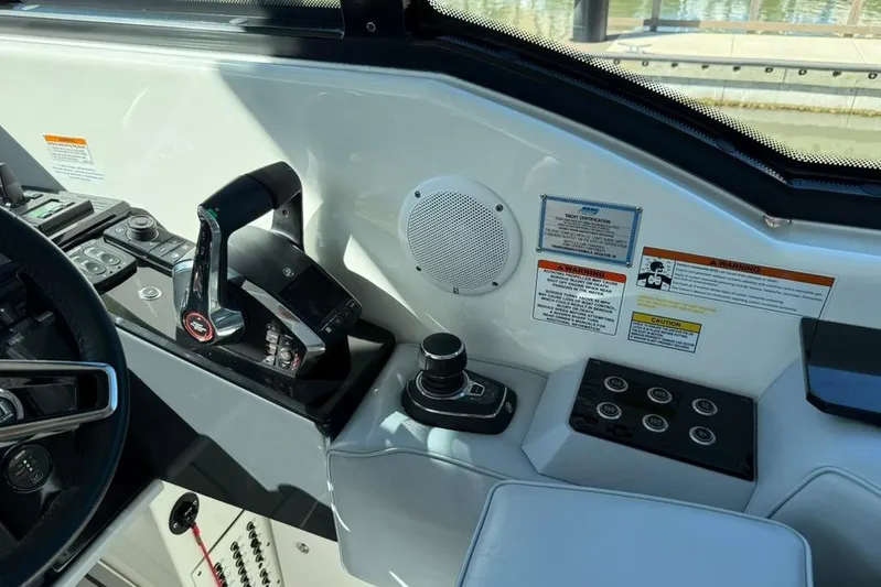  Yacht Photos Pics 2022 Formula 500 Super Sport Crossover helm with controls and warning labels.