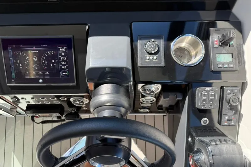  Yacht Photos Pics 2022 Formula 500 Super Sport Crossover dashboard with steering wheel and control panel.