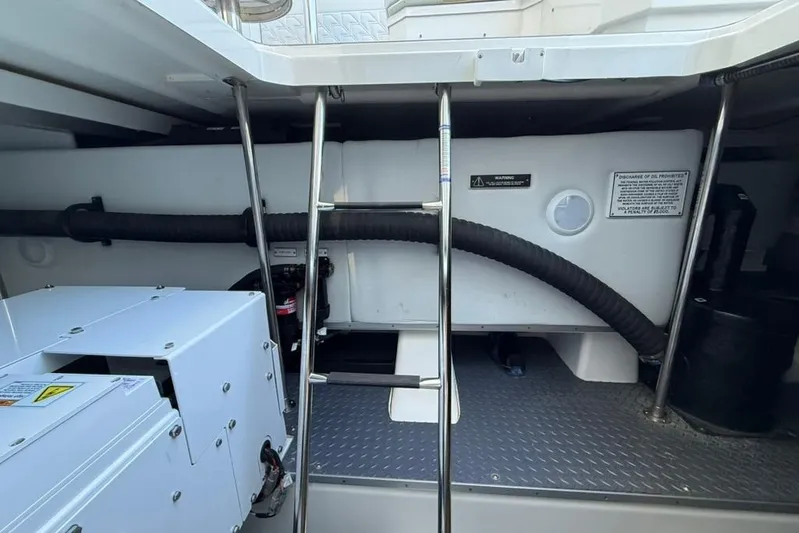  Yacht Photos Pics Engine compartment of 2022 Formula 500 Super Sport Crossover with ladder and equipment.