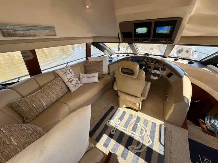  Yacht Photos Pics Luxurious interior of 2005 Carver 56 Voyager yacht with plush seating and modern dashboard.