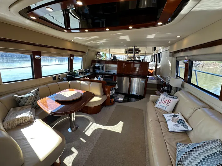  Yacht Photos Pics Luxurious interior of a 2005 Carver 56 Voyager yacht with elegant seating and modern amenities.