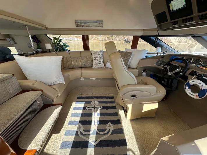  Yacht Photos Pics Luxurious interior of 2005 Carver 56 Voyager yacht with plush seating and nautical decor.