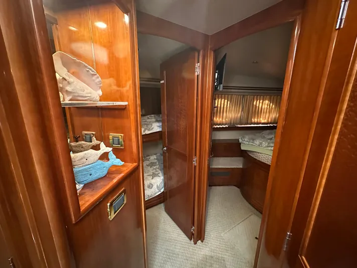  Yacht Photos Pics Interior of 2005 Carver 56 Voyager yacht with wooden cabinetry and cozy sleeping quarters.