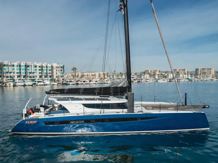 Flash Yacht Photos Pics 2017 HH Catamarans HH66 sailing in a marina, featuring sleek design and modern architecture.