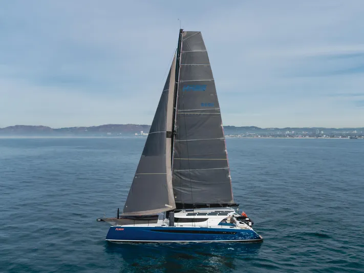 Flash Yacht Photos Pics 2017 HH Catamarans HH66 sailing on open water, featuring sleek design and modern sails.