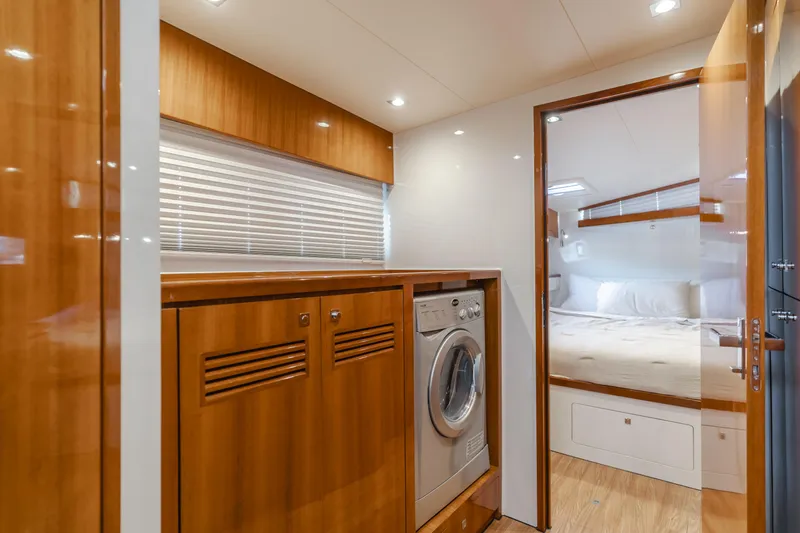 Flash Yacht Photos Pics Interior of 2017 HH Catamarans HH66, featuring a laundry area and cozy bedroom.