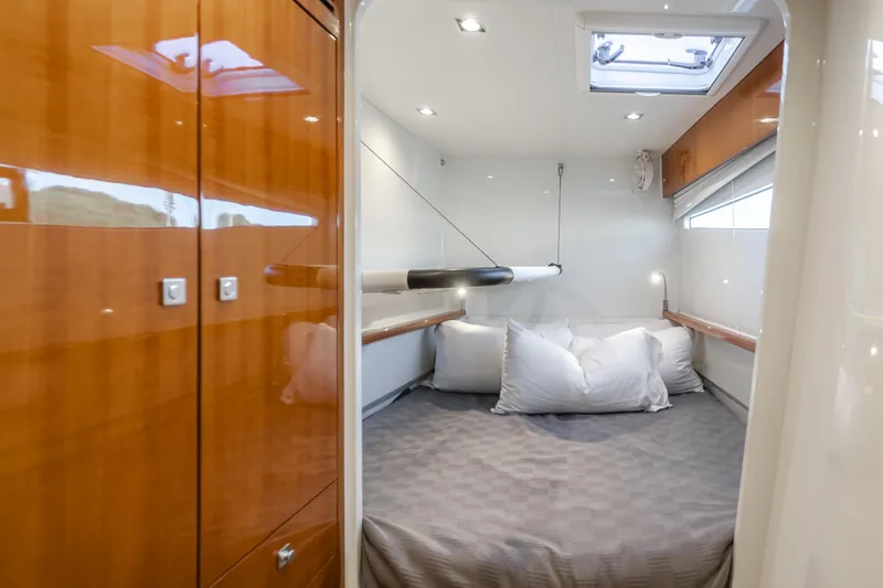 Flash Yacht Photos Pics Luxurious cabin interior of 2017 HH Catamarans HH66 with cozy bed and wooden finishes.