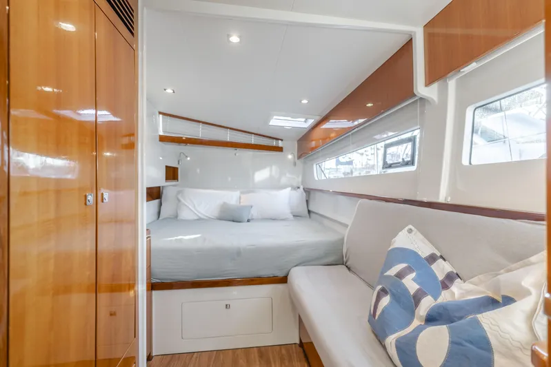 Flash Yacht Photos Pics Luxurious interior of 2017 HH Catamarans HH66 with cozy bed and seating area.
