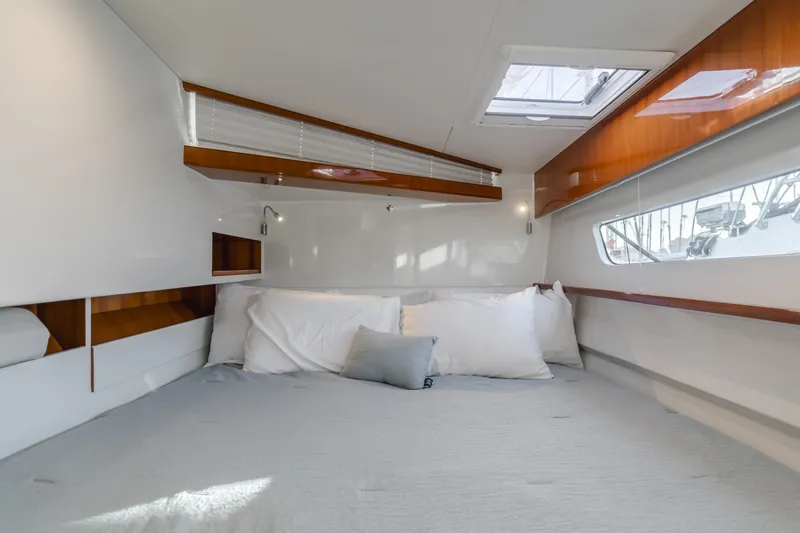 Flash Yacht Photos Pics 2017 HH Catamarans HH66 cabin interior with bed, pillows, and natural light.