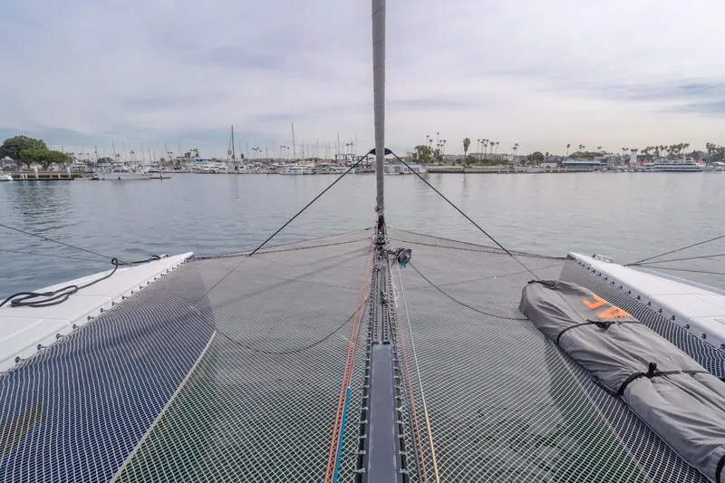 Flash Yacht Photos Pics 2017 HH Catamarans HH66 catamaran netting with marina view in the background.