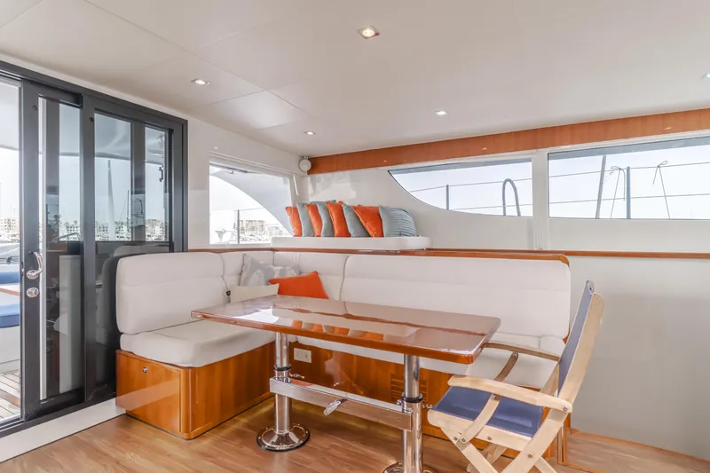 Flash Yacht Photos Pics Luxurious interior of 2017 HH Catamarans HH66 with elegant seating and modern design.