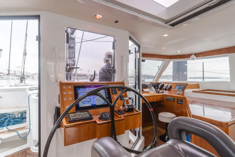 Flash Yacht Photos Pics Helm station of 2017 HH Catamarans HH66, featuring navigation equipment and luxurious seating.