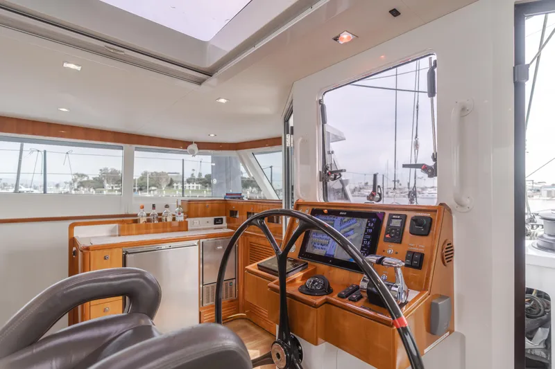 Flash Yacht Photos Pics Luxurious interior of 2017 HH Catamarans HH66 with modern navigation equipment and sleek design.