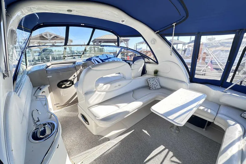  Yacht Photos Pics Interior of 2000 Sea Ray 410 Sundancer yacht with seating and table.
