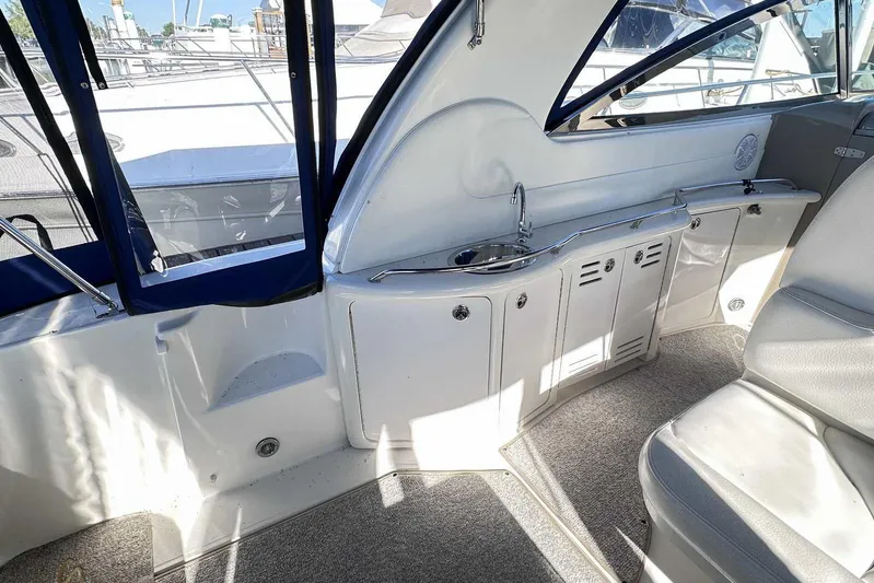  Yacht Photos Pics Interior of 2000 Sea Ray 410 Sundancer yacht with kitchenette and seating area.