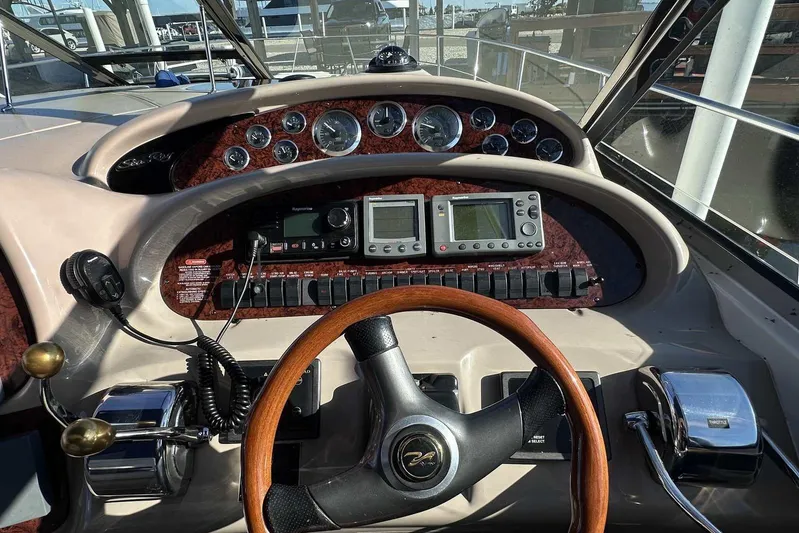  Yacht Photos Pics Cockpit of 2000 Sea Ray 410 Sundancer with steering wheel and navigation instruments.