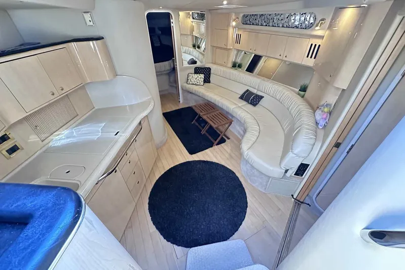  Yacht Photos Pics Luxurious interior of 2000 Sea Ray 410 Sundancer yacht with elegant seating and modern amenities.