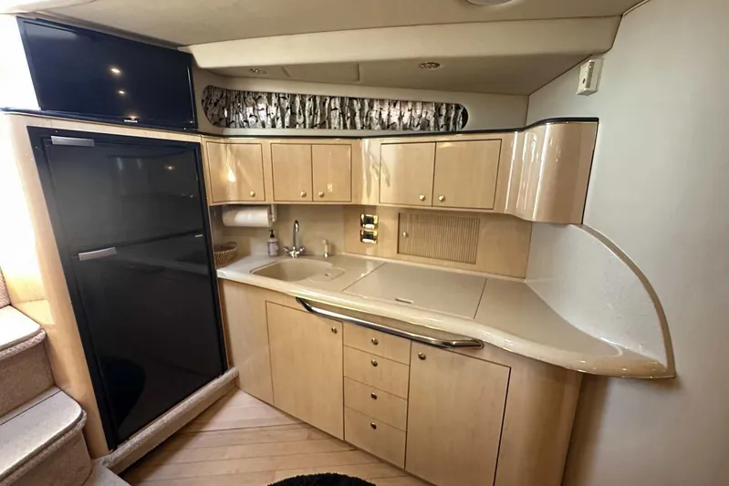  Yacht Photos Pics Interior of 2000 Sea Ray 410 Sundancer yacht with kitchenette and modern amenities.