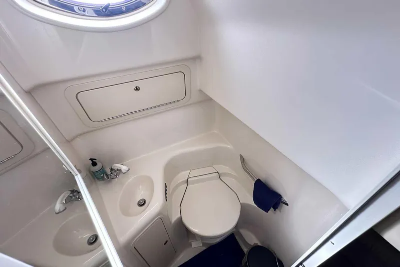  Yacht Photos Pics Bathroom interior of 2000 Sea Ray 410 Sundancer yacht, featuring sink and toilet.
