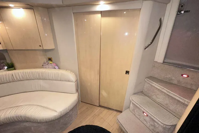  Yacht Photos Pics Interior of 2000 Sea Ray 410 Sundancer with plush seating and carpeted stairs.