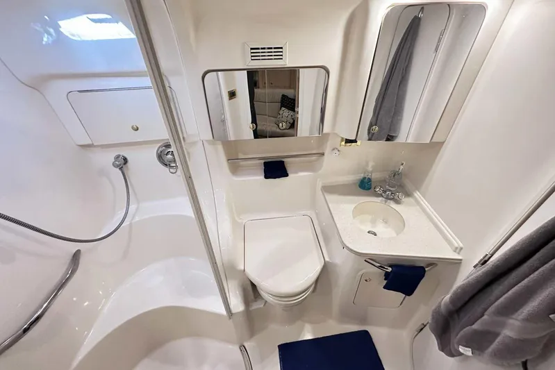  Yacht Photos Pics Luxurious bathroom in 2000 Sea Ray 410 Sundancer yacht, featuring modern fixtures and elegant design.