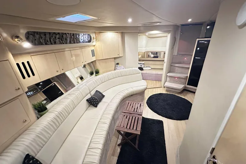  Yacht Photos Pics Luxurious interior of a 2000 Sea Ray 410 Sundancer yacht with elegant seating and modern decor.