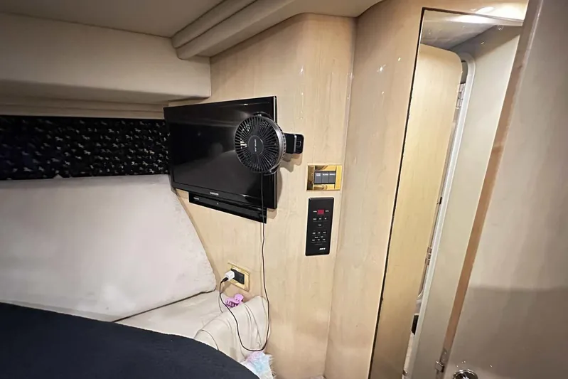  Yacht Photos Pics Interior of 2000 Sea Ray 410 Sundancer with TV and fan mounted on wall.