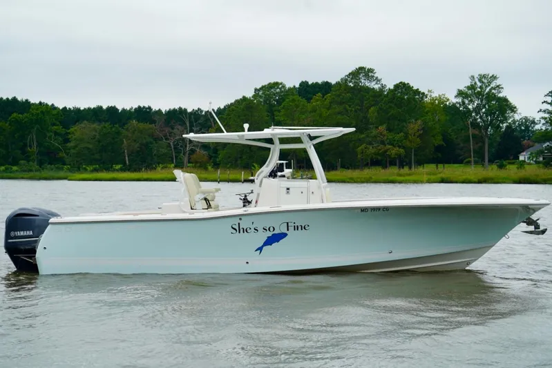 Yacht Photos Pics 2015 Southport 29 FE boat on water, side view, with Yamaha engine.