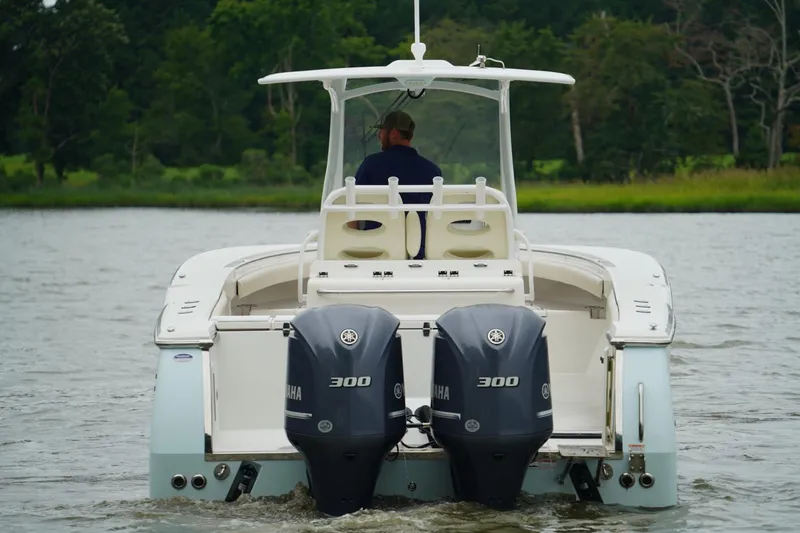  Yacht Photos Pics 2015 Southport 29 FE boat with dual Yamaha 300 engines on a calm river.
